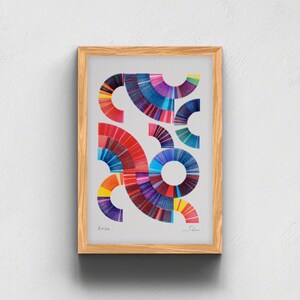 May include: A framed print featuring a light gray background with multiple colorful, circular, and semi-circular geometric patterns composed of fine, radiating lines in shades of red, blue, purple, orange, and yellow. The text 2026 is visible.