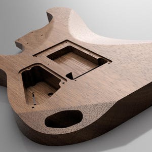 May include: An unfinished electric guitar body crafted from dark brown wood with a visible grain pattern. The body features routed cavities for pickups, electronics, and a bridge, along with a pre-drilled hole for a volume or tone control knob.