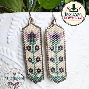 May include: A pair of rectangular beaded earrings featuring a floral pattern with a cream background, green stems, and purple and dark gray flower petals. The earrings are suspended from metal hooks and display a detailed woven beadwork design.