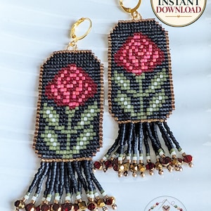 May include: A pair of rectangular beaded earrings featuring a rose motif in shades of pink, green, and black. The earrings have gold-tone leverback hooks and a fringe of black, white, and metallic beads at the bottom edge.