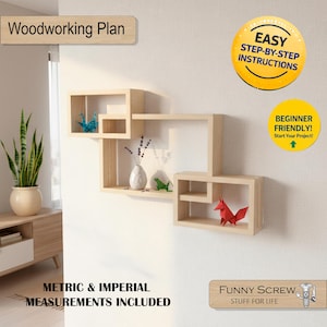 May include: A light-colored, geometric wall shelf unit with three sections. The unit is mounted on a white wall and contains decorative items, including origami figures and a small vase. Text on the image reads "Woodworking Plan" and "Metric & Imperial Measurements Included."
