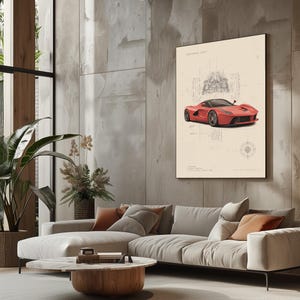 Puede incluir: Una impresi&oacute;n de arte mural enmarcada que presenta una ilustraci&oacute;n de un coche deportivo rojo superpuesta sobre esquemas t&eacute;cnicos con l&iacute;neas negras finas y texto sobre un fondo crema, exhibida verticalmente en una pared de hormig&oacute;n.