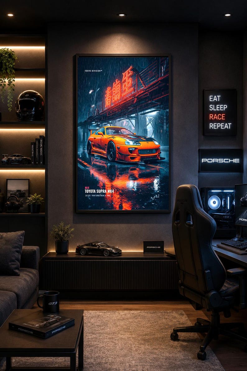 May include: A framed vertical wall poster featuring a bright orange Toyota Supra MK4 parked on a wet city street at night under glowing red neon signs. The text on the poster reads TOKYO DIVISION, TOYOTA SUPRA MK4, and 2JZ-GTE TWIN TURBO ENGINE.