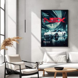 May include: A framed vertical wall poster featuring a white Honda NSX NA1 sports car parked on a wet city street at night. The text NSX is displayed in large red letters at the top, with Honda NSX NA1 printed in white at the bottom of the poster.