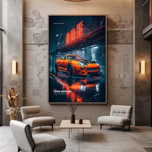 May include: A large vertical wall art print featuring an orange Toyota Supra MK4 sports car parked on a wet city street at night. The scene includes neon red Chinese characters, rain, and reflections. Text reads TOKYO DIVISION and TOYOTA SUPRA MK4.