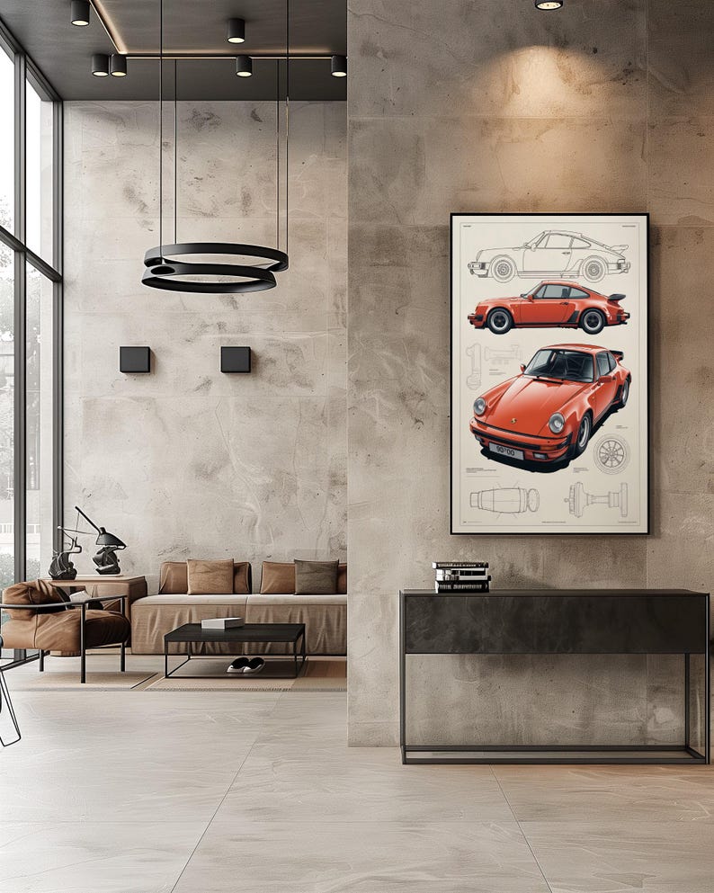 May include: A framed wall art print featuring a technical illustration of a classic orange sports car. The artwork displays a side profile line drawing, a side view in orange, and a front three-quarter view of the car, alongside mechanical diagrams.