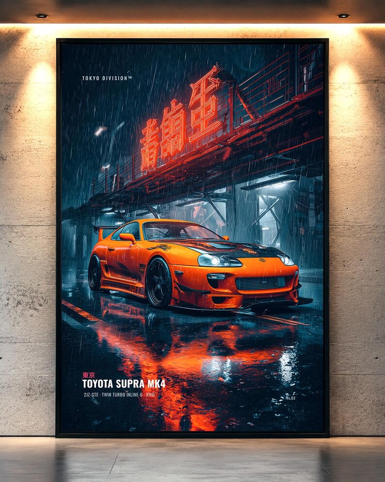 May include: A vertical wall art print featuring a bright orange Toyota Supra MK4 parked on a wet city street at night. The scene includes heavy rain, glowing red neon Japanese kanji signage, and the text TOKYO DIVISION and TOYOTA SUPRA MK4.