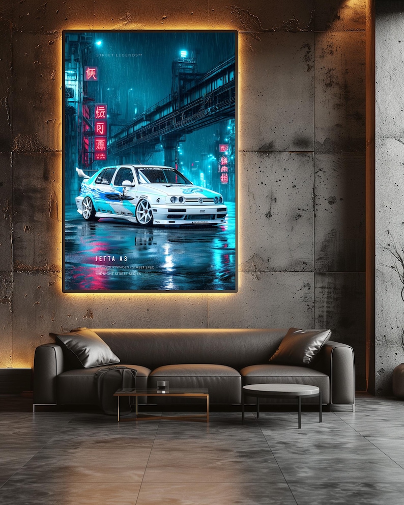 May include: A framed wall art print featuring a white Jetta A3 car with blue graphic decals, parked on a wet city street at night. The scene is illuminated by vibrant neon blue and red lights, with Japanese characters and the text Jetta A3 visible.