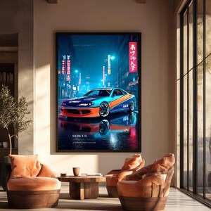 May include: A framed vertical wall art print featuring a blue and orange Nissan Silvia S15 sports car parked on a wet city street at night. The image includes neon signs with Japanese text, the words DRIFT DISTRICT, and SILVIA S15 at the bottom.