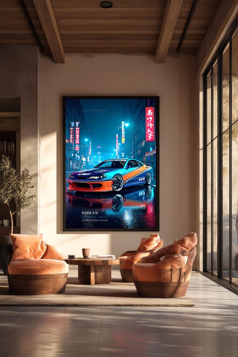 May include: A framed vertical wall art print featuring a blue and orange Nissan Silvia S15 sports car parked on a wet city street at night. The image includes neon signs with Japanese text, the words DRIFT DISTRICT, and SILVIA S15 at the bottom.
