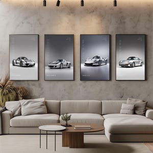 May include: Four vertical framed posters featuring silver Porsche sports cars displayed on a concrete wall. The prints include the 918 Spyder, Carrera GT, 911 GT1, and 959 models, each with model text labels against a clean, light gray background.