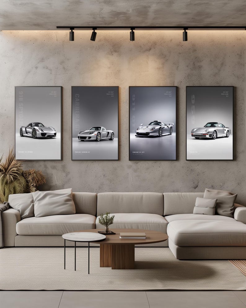 May include: Four vertical framed posters featuring silver Porsche sports cars displayed on a concrete wall. The prints include the 918 Spyder, Carrera GT, 911 GT1, and 959 models, each with model text labels against a clean, light gray background.