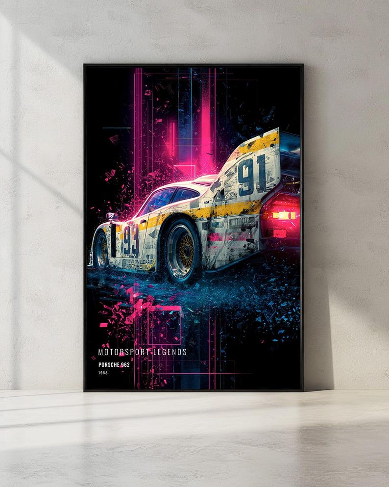 May include: A framed wall art print featuring a Porsche 962 race car with the number 91, set against a dark background with vibrant pink and blue neon light streaks. The text reads MOTORSPORT LEGENDS, PORSCHE 962, and 1988 at the bottom.