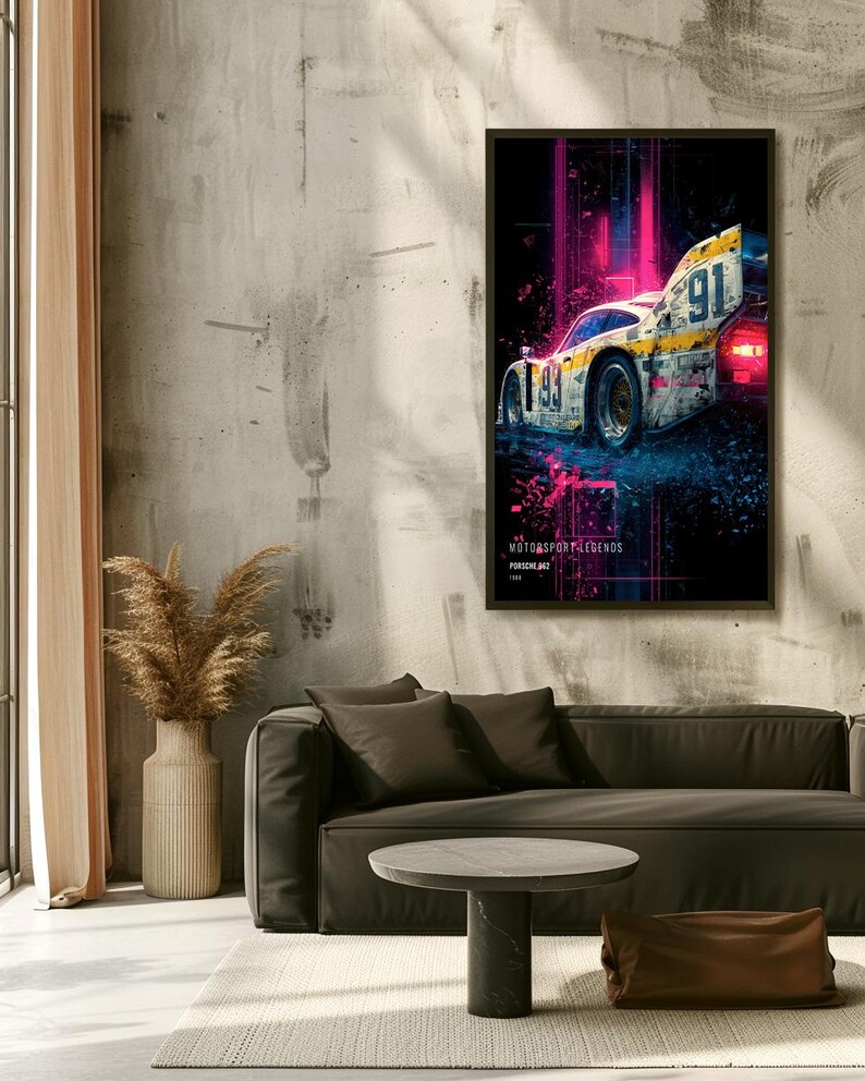 May include: A rectangular wall art print featuring a white and yellow race car with the number 91, set against a dark background with vibrant pink light streaks. The text MOTORSPORT LEGENDS and PORSCHE 962 are printed at the bottom of the artwork.