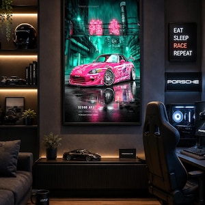 May include: A framed wall poster featuring a bright pink Honda S2000 AP1 sports car parked on a wet city street at night. The artwork displays neon teal lighting, Japanese characters, and the text S2000 AP1 2001 HONDA S2000 MIDNIGHT STREET SERIES.