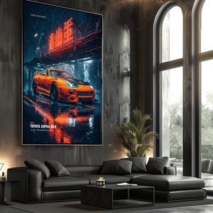 May include: A vertical wall art print featuring a bright orange Toyota Supra MK4 sports car parked on a wet, reflective city street at night. The scene includes glowing red neon Japanese text above the car and the text TOYOTA SUPRA MK4 below.