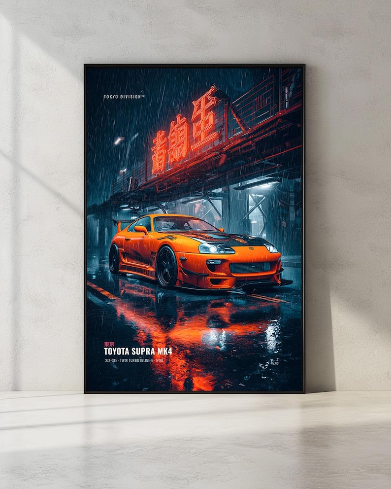 May include: A vertical poster featuring an orange Toyota Supra MK4 parked on a wet city street at night. Above the car, a bright red neon sign glows against a dark, rainy backdrop. The text TOKYO DIVISION and TOYOTA SUPRA MK4 are visible.