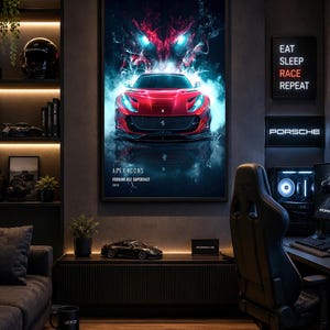 May include: A framed vertical wall poster featuring a red Ferrari 812 Superfast car with glowing blue headlights and a red smoke effect. The text reads APEX ICONS, FERRARI 812 SUPERFAST, 2018. The poster is displayed in a dark room with ambient lighting.