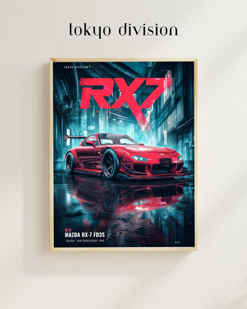 May include: A framed poster featuring a red Mazda RX-7 FD3S sports car parked on a wet city street at night. The text reads "tokyo division", "RX7", and "MAZDA RX-7 FD3S 13B-REW TWIN TURBO ROTARY RWD". The scene is illuminated by bright neon blue lighting.
