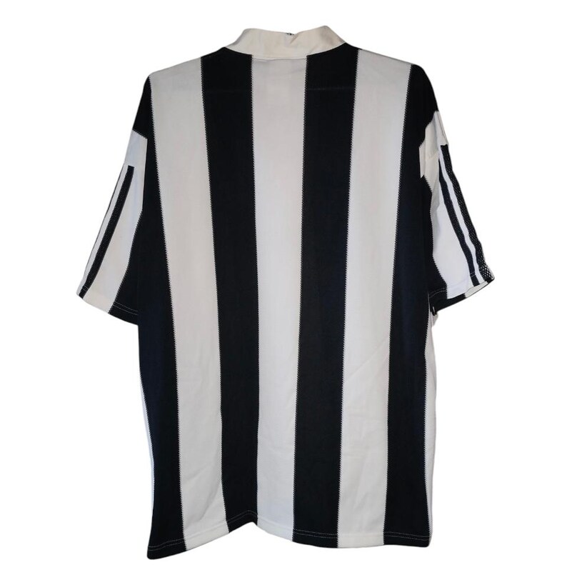May include: A short-sleeved, collared jersey with bold black and white vertical stripes. The jersey has a white collar and white sleeves with black stripes. The back of the jersey is visible, showcasing the striped pattern.