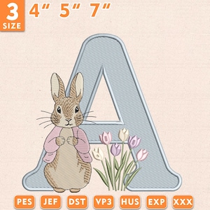 May include: An embroidered design featuring a light blue letter "A" with a bunny wearing a pink jacket, and a bouquet of tulips. The design is available in 3", 4", 5", and 7" sizes. The image also shows the file formats: PES, JEF, DST, VP3, HUS, EXP, and XXX.