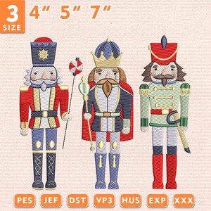 May include: Three machine embroidery designs of nutcracker figures in red, blue, and green uniforms. The figures include a soldier with a staff, a king with a crown and scepter, and a soldier with a sword. Text indicates 3 sizes: 4", 5", 7".