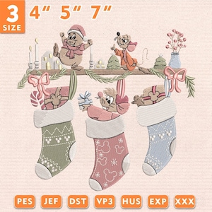May include: An embroidery design featuring three Christmas stockings hanging from a shelf with two mice characters. The stockings are green, pink, and blue with white cuffs and patterns. The shelf holds candles, a vase, and trees. Text reads 3 4" 5" 7".