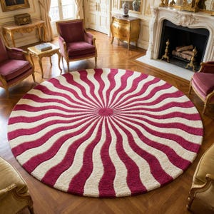 May include: A large, round rug with a striking design. Alternating bands of white and deep red radiate from the center, creating a sunburst pattern. The rug is placed in a room with classic furniture and a fireplace, adding a bold statement to the space.