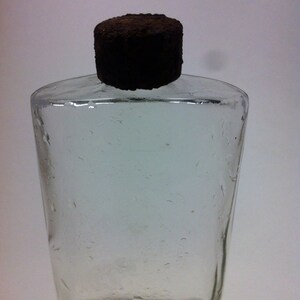 Antique Perfume Bottle  Clear Glass Rusted Cover