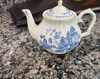 Tetera individual de porcelana azul y blanca con diseño Robinson Design.