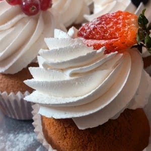 Gourmet Cupcakes with Whipped Frosting and Berries