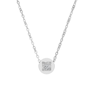 May include: A silver-colored necklace with a delicate chain and a circular pendant. The pendant features a QR code design. The necklace is displayed against a white background, highlighting its minimalist style and modern aesthetic.