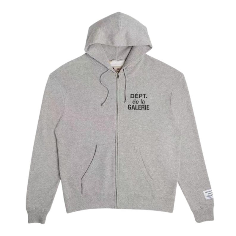 May include: A light gray zip-up hoodie with a hood and front pockets. The text "D&Eacute;PT. de la GALERIE" is printed in black on the chest. A small tag with text is on the left sleeve.