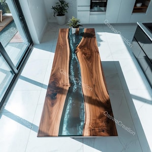 May include: A rectangular wooden table with a dark blue resin river design running down the centre. The table is made of natural wood with a glossy finish. A small plant sits on the table.