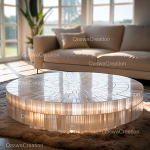 Puede incluir: Una mesa de centro redonda y blanca con una parte superior similar a un mosaico y una base cilíndrica. La mesa tiene aproximadamente 91 cm de diámetro y está sobre una alfombra peluda. El texto "QaswaCreation" es visible.