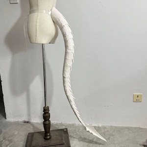 May include: A set of three ceramic mugs with a speckled, matte finish. The mugs are in shades of cream, light gray, and dark gray. Each mug has a simple, minimalist design, perfect for coffee or tea.