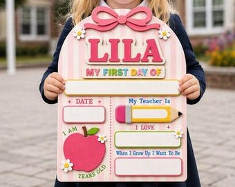 May include: A pink and white striped wooden sign for the first day of school featuring the name LILA in large pink letters, a pink bow, a red apple, a pencil graphic, and blank spaces for writing the date, teacher name, age, and future goals.