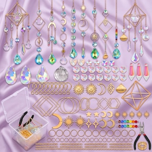 May include: A comprehensive suncatcher making kit featuring various gold-toned metal geometric frames, iridescent crystal prisms, assorted celestial charms like suns and moons, jump rings, chains, and jewelry pliers in a clear plastic storage box.