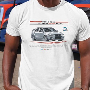 May include: White t-shirt featuring a silver car graphic with the text "WORLD TOUR RACING 90s". The design includes red, white, and blue stripes. The shirt is a classic crew neck style.