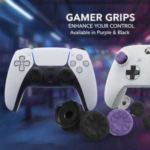 May include: White and black game controllers with purple and black thumb grips. The image includes the text "GAMER GRIPS" and "ENHANCE YOUR CONTROL Available in Purple & Black."