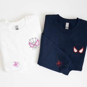 May include: A white ceramic mug with a black handle and the text "But First, Coffee" in a black, bold font. The mug is sitting on a white surface.