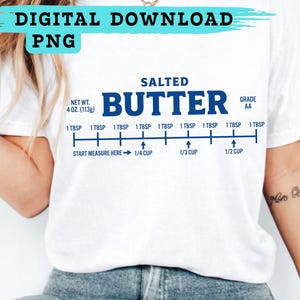 May include: White t-shirt with a blue graphic that reads "SALTED BUTTER" and a butter measurement guide. The shirt also has the text "DIGITAL DOWNLOAD PNG" at the top. The net weight is 4 oz (113g).
