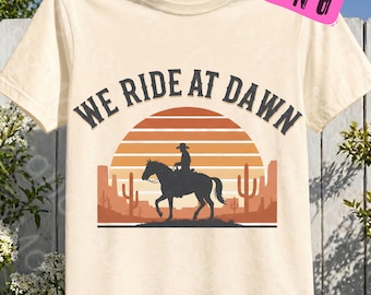 We Ride at Dawn PNG Vintage Western Cowboy Silhouette Desert Sunset Retro Rodeo Art Wild West Cowboy Riding Horse Country Western Sublimatio