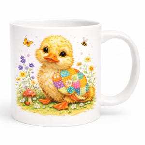 May include: White ceramic mug featuring a yellow duckling with an orange beak and feet. The duckling has a colourful patchwork design and is surrounded by flowers, butterflies, and a bee. A whimsical design for a coffee or tea mug.