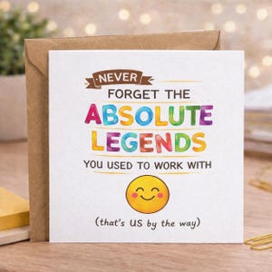 May include: A white card with the message "NEVER FORGET THE ABSOLUTE LEGENDS YOU USED TO WORK WITH" in colourful letters. A yellow smiley face is at the bottom. The card is inside a brown envelope.