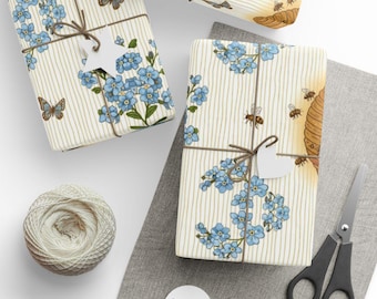 Papel de embrulho com estampa de favos de mel, abelhas e miosótis, para presente.