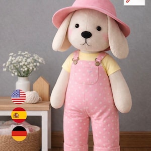 May include: A plush dog doll, 45 cm tall, wearing a pink hat and overalls with white polka dots. The doll has a yellow shirt underneath the overalls. The doll has a black nose and is wearing a pink hat. The doll is a stuffed animal.