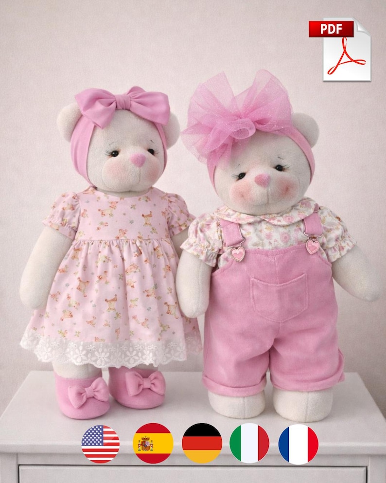 May include: Two white teddy bears wearing pink outfits. One bear is in a dress with a lace hem and matching shoes. The other bear is in pink overalls and a floral top, with a large pink bow. A PDF icon is in the top right corner.