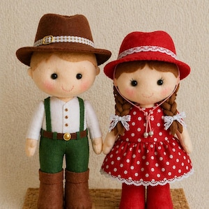 May include: Two handmade felt dolls, a boy and a girl, stand together. The boy doll wears a brown hat, white shirt, green trousers, and brown boots. The girl doll wears a red polka-dot dress and red hat. Both dolls have rosy cheeks.