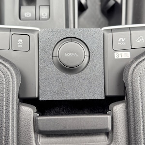 May include: A rustic wooden sign with the text "Welcome to our home" in white lettering. The sign features a distressed finish and a simple, inviting design, perfect for entryway decor.